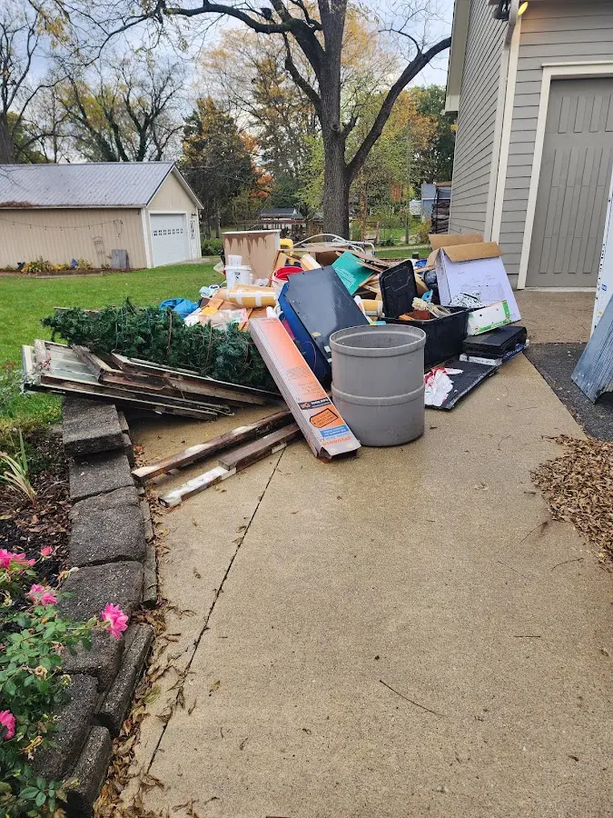 Dumpster being loaded with debris for 3 Yard Dumpster Rental in Shelbyville